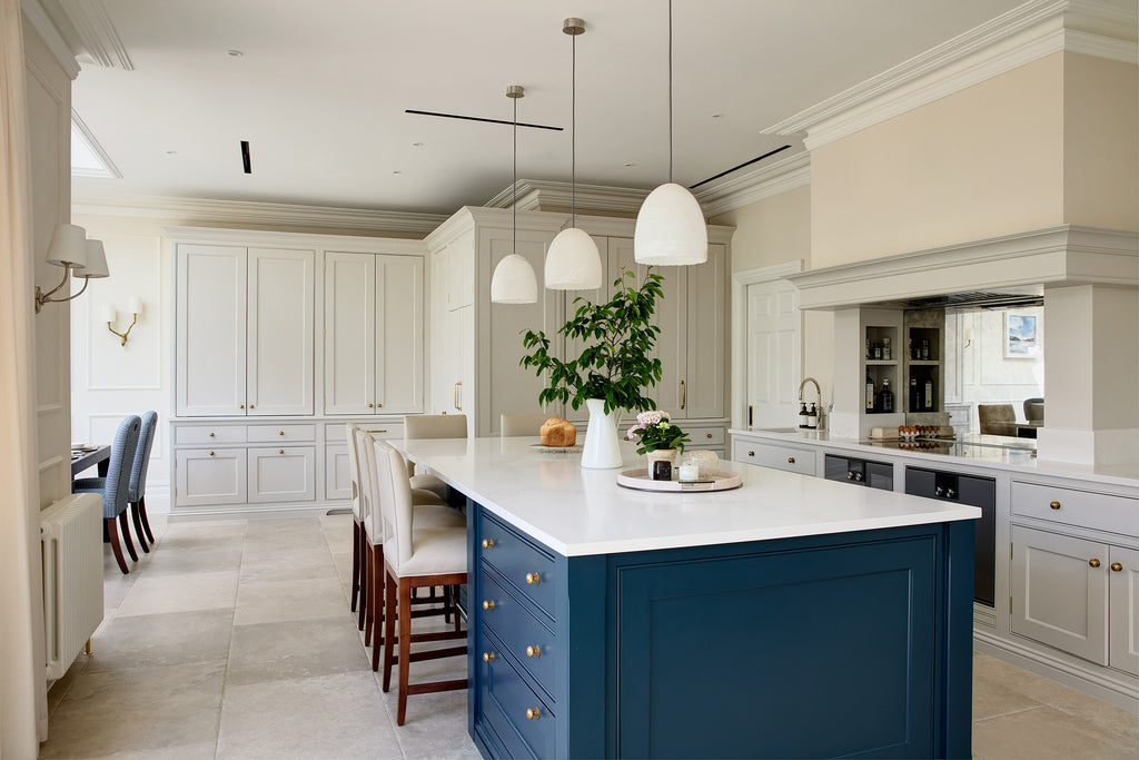 Modern kitchen with a blue island and white countertops